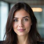Portrait of Dr. Lena Sharma, Head of Product at ThriveVault.
